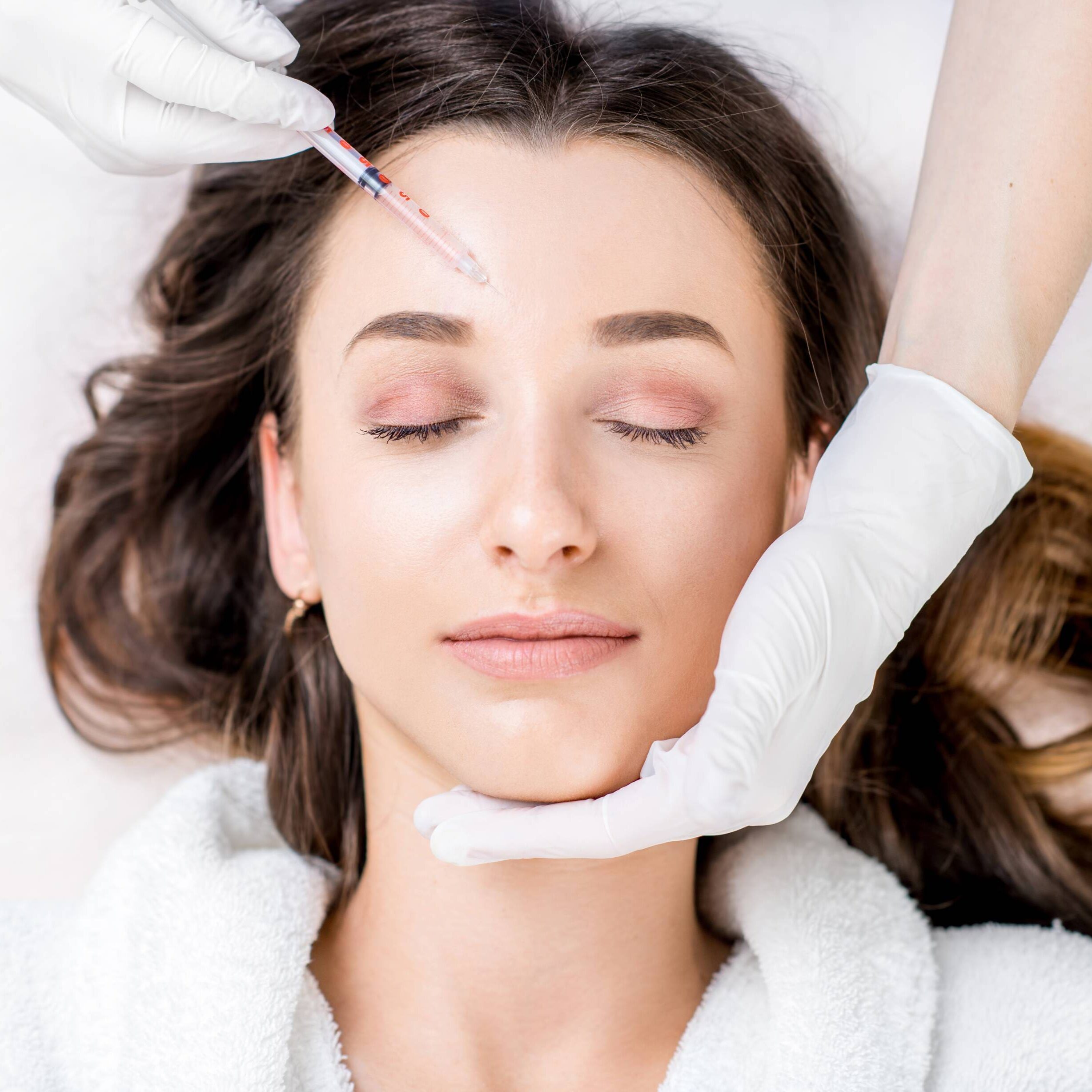GettyImages-656650192 A woman getting her eyebrows threaded at the salon